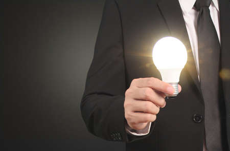 Holding lightbulb in a handの写真素材