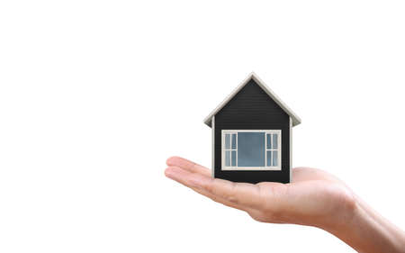 Mortgage concept with house placed on handの写真素材