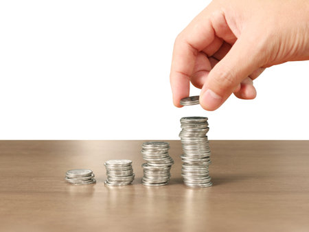 human hand putting coin to money, business ideas