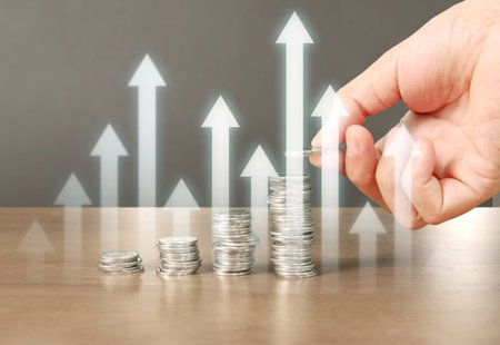 human hand putting coin to money, business ideas