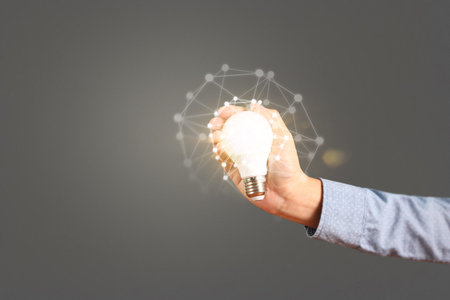 holding lightbulb in a hand