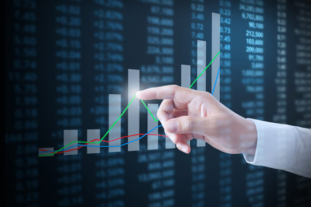 Investment concept,hand with financial chart symbols coming from hand