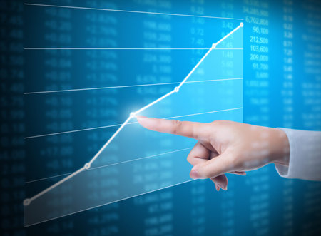 Investment concept,hand with financial chart symbols coming from handの写真素材