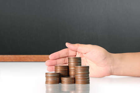 Concept of money growing from coins in handの写真素材