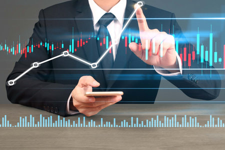 Investment concept,hand with stock financial chart symbols coming from hand