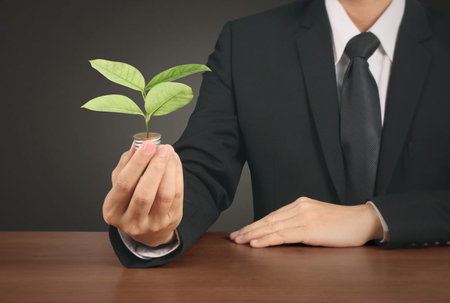 hand holding a light bulb with energy の写真素材