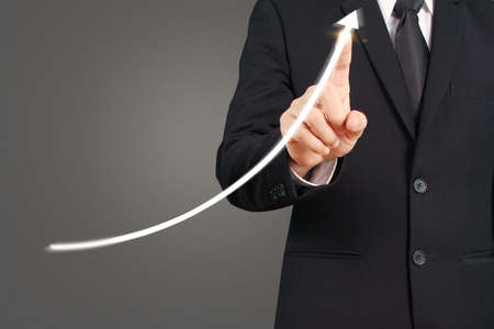 Investment concept,hand with stock financial chart symbols coming from handの写真素材