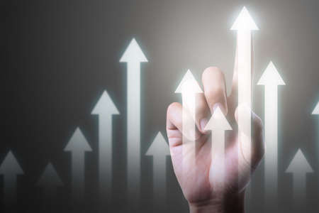 Businessman plan graph growth and increase of chart positive indicators in his businessの写真素材