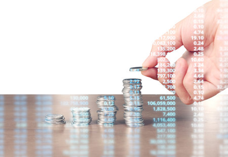 human hand putting coin to money, business ideas
