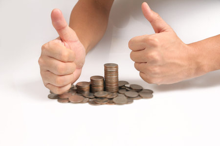saving money concept preset hand putting money coin stack growing business