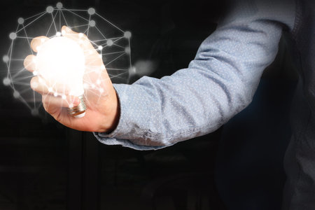 energy saving light bulb in a hand