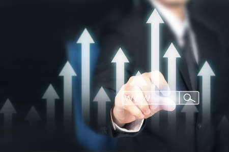 Businessman plan graph growth and increase of chart positive indicators in his businessの写真素材