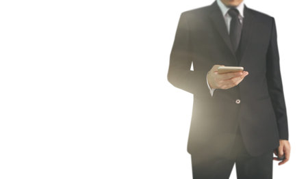 Attractive business man using smartphone in hand