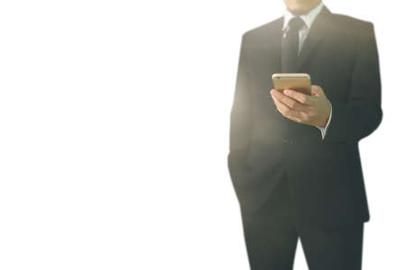 Attractive business man using smartphone in handの写真素材