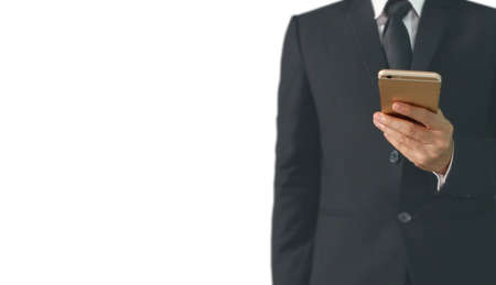 Attractive business man using smartphone in handの写真素材