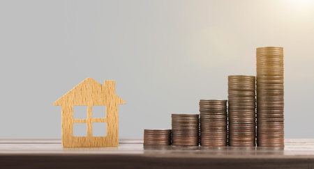 View of coin stack  house model  savings plans for house in