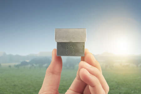 Mortgage concept by house from in a handの写真素材