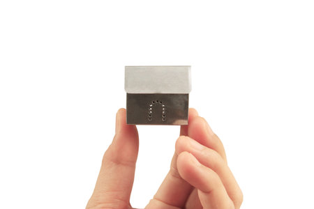 Mortgage concept by house from in a hand