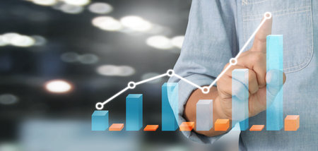 Businessman plan graph growth and increase of chart positive indicators in his businessの写真素材