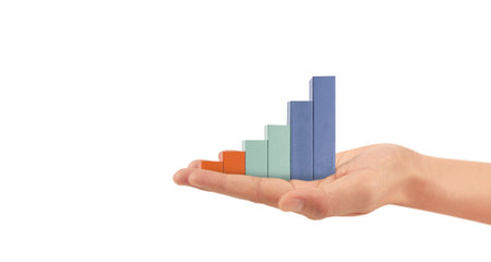 Wood block stacking as step stair with arrow up in a hand. Ladder career path concept for business...