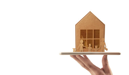 Wooden toy house. Mortgage property home concept. Buying house for family. model in hand