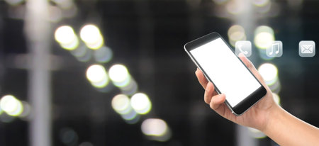 Man hand holding smartphone device and touching screen.business ideaの写真素材