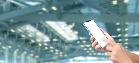 Man hand holding smartphone device and touching screen.business idea