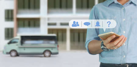 Man hand holding smartphone device and touching screen.business ideaの写真素材