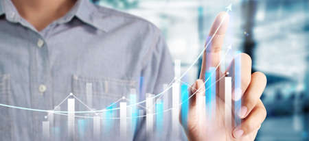 Businessman plan graph growth and increase of chart positive indicators in his businessの写真素材