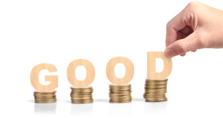 Wooden cube in hand with word with coins stack step up. growing growth value