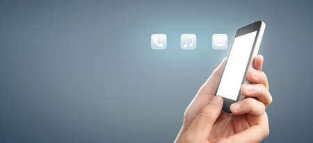 Man hand holding smartphone device and touching screen.business ideaの写真素材