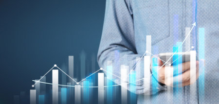 Hand holding smartphone device and touching screen. Stock exchange market concept. businessman...