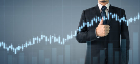Businessman plan graph growth and increase of chart positive indicators in his business