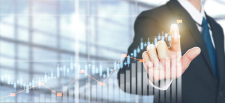 Businessman plan graph growth and increase of chart positive indicators in his business