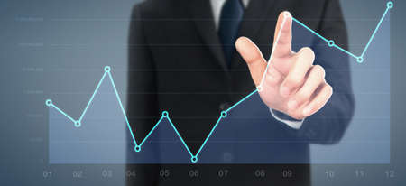 Businessman plan graph growth and increase of chart positive indicators in his businessの写真素材
