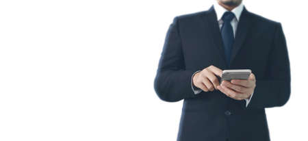 Man hand holding a smartphone device and touching screenの写真素材