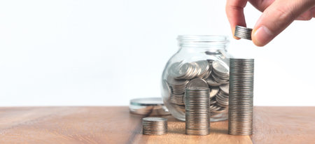 Coins stacked on each other in different positions. coins in a hand business casual money