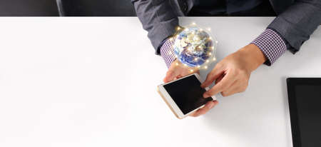 Hand holding smartphone device and touching screen, searching or social networks conceptの写真素材