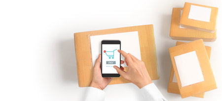 Hand holding smartphone device and touching screen, Business owner working. Online shopping SME...
