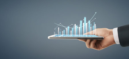 Business plan graph growth and increase of chart positive indicators in his business, tablet in hand