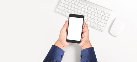 Hand holding smartphone device and touching screen
