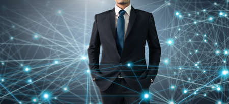 Businessman on blurred background using Social network connection interfaceの写真素材
