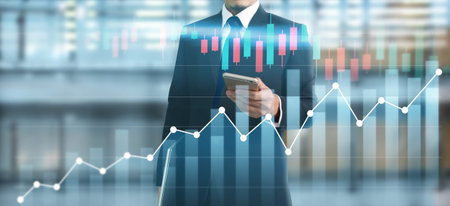 Smartphone in hand and plan graph growth and increase of chart positive indicators in his business