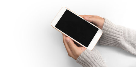 Hand holding smartphone device and touching screen