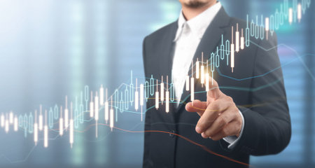 Businessman plan graph growth and increase of chart positive indicators in his business
