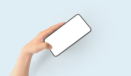 Hand holding smartphone device and touching screen