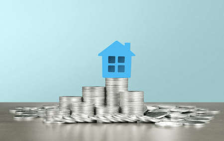 Model of detached miniature house mock up on coins. property real estate investment conceptの写真素材