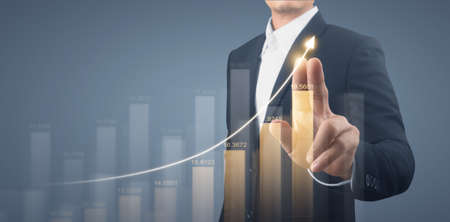 Businessman plan graph growth and increase of chart positive indicatorsの写真素材