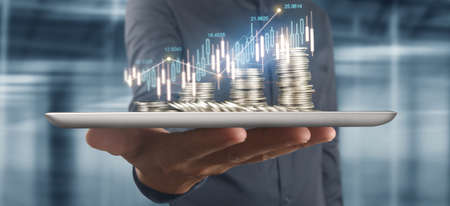 Coin and wealth concept. Loads of money on glass representing tabletの写真素材