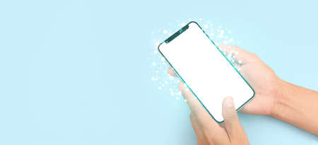 Hand holding smartphone device and touching screenの写真素材